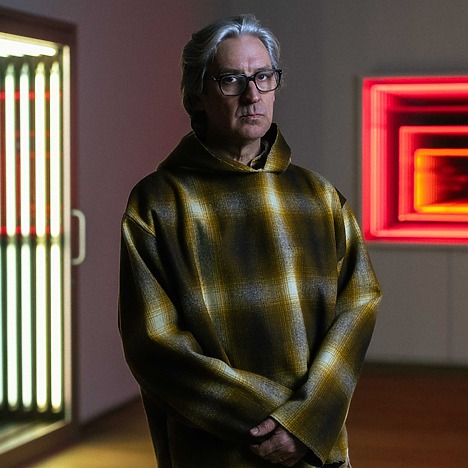 Ivan Navarro in front of his artworks Blank Door, 2006 (left) and No Se Puede Mirar, 2013 (right).