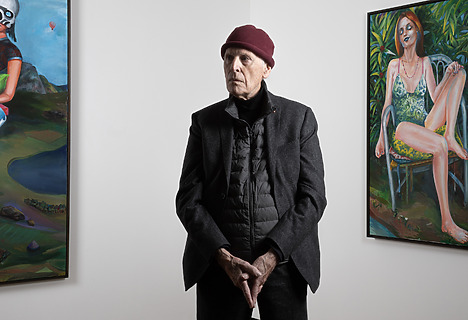 Martial Raysse standing in front of his paintings La Reine du Monde, 2018 (left) and Audrey, 2019 (right)