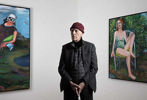 Martial Raysse standing in front of his paintings La Reine du Monde, 2018 (left) and Audrey, 2019 (right)
