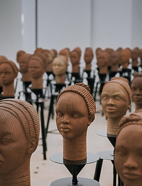 Close up of some of the faces of the Chibok girls, molded by potters and students.