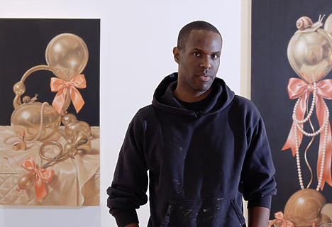 David Smalling in front of his artworks.